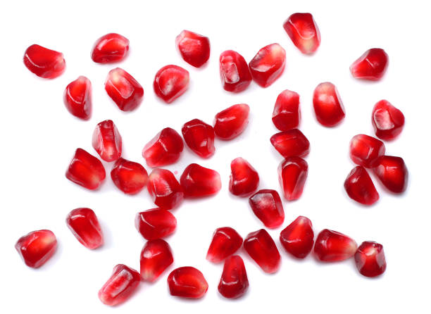 istock pomegranate seeds isolated on white background. top view. pomegranate berries. 881663930