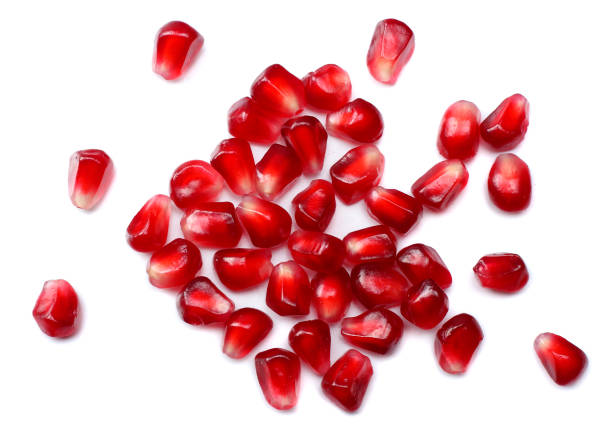 istock pomegranate seeds isolated on white background. top view. pomegranate berries. 881663944