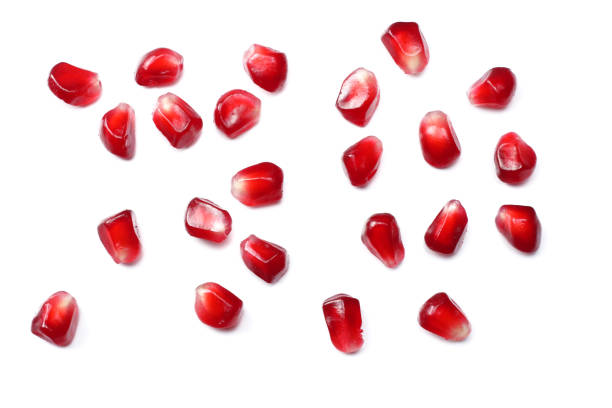 istock pomegranate seeds isolated on white background. top view. pomegranate berries. 881663972