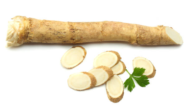 istock sliced horseradish root with parsley isolated on white background 881664258