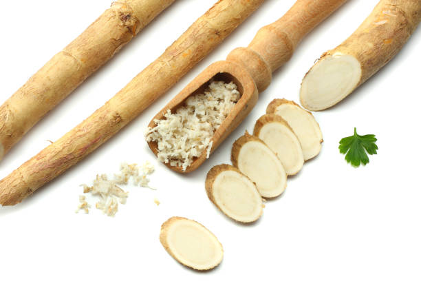 istock sliced horseradish root with parsley isolated on white background 881664342