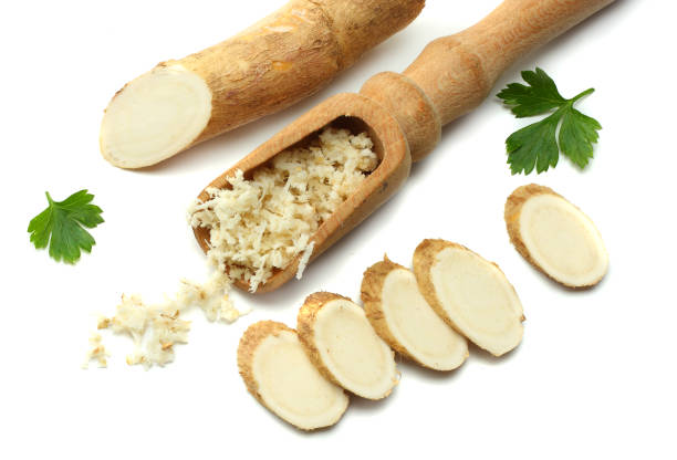 istock sliced horseradish root with parsley isolated on white background 881664356
