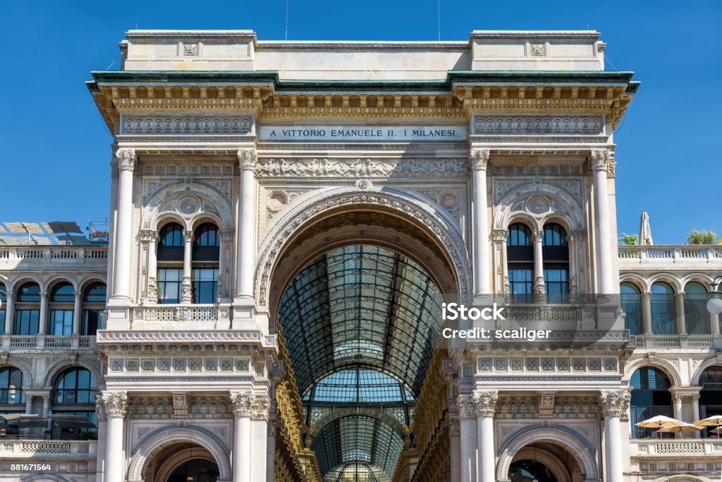 Galleria Vittorio Emanuele II in Milan, Italy Galleria Vittorio Emanuele II on the Piazza del Duomo (Cathedral Square) in Milan, Italy. This gallery is one of the world's oldest shopping malls and tourist attraction of Milan. Arcade Stock Photo