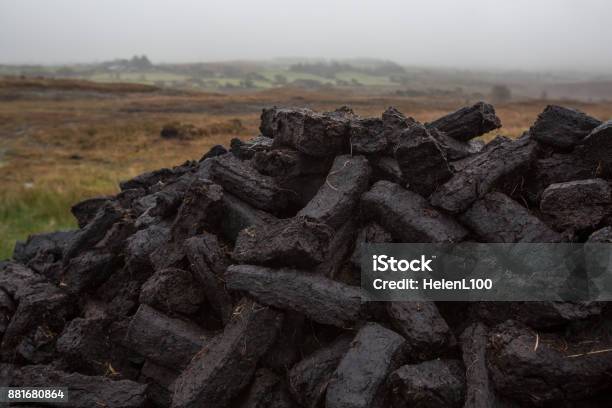 Pile Of Turf In Misty Irish Countryside Stock Photo - Download Image Now - Ireland, Turf, Peat Bog