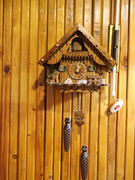 istock cuckoo clock on a wooden wall 881687624