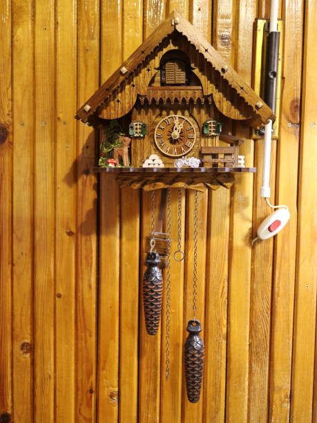istock cuckoo clock on a wooden wall 881687628