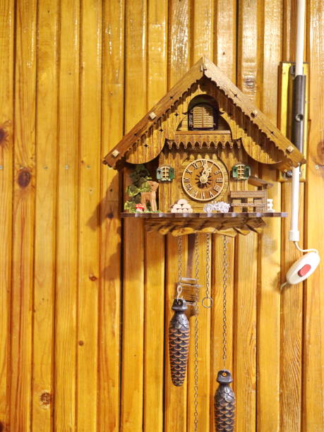 istock cuckoo clock on a wooden wall 881687660