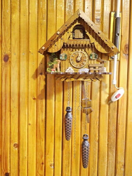 istock cuckoo clock on a wooden wall 881687670