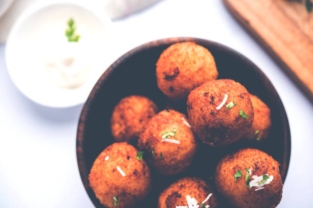 istock Fried potato cheese balls or croquettes with tomato ketchup. Selective focus 881700262