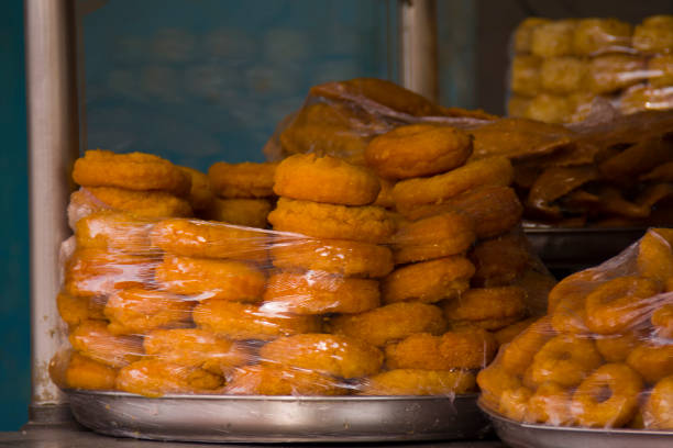 istock pile of doughnuts in the shop 881707376