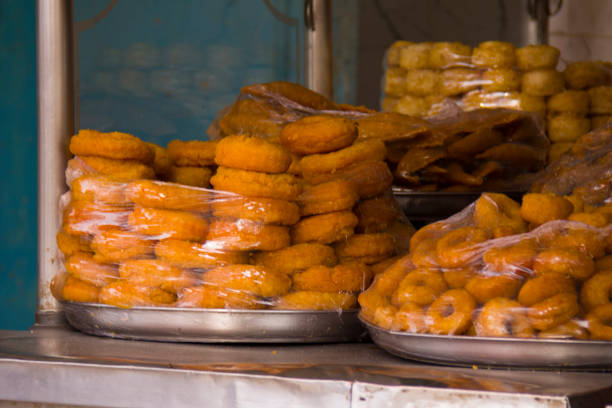istock packed doughnuts in heaps for sale 881707422