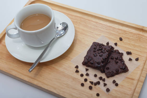 A cup of Coffee and chocolate brownie crackers.