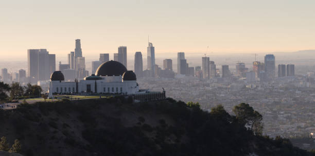 Beautiful Light Los Angeles Downtown City Skyline Urban Metropolis The obseratory dominates the forground with the city skyline of Los Angeles in the background griffith park observatory stock pictures, royalty-free photos & images