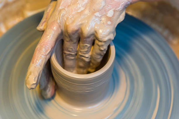 istock womens hands of a potter creating an earthen jar 881719776