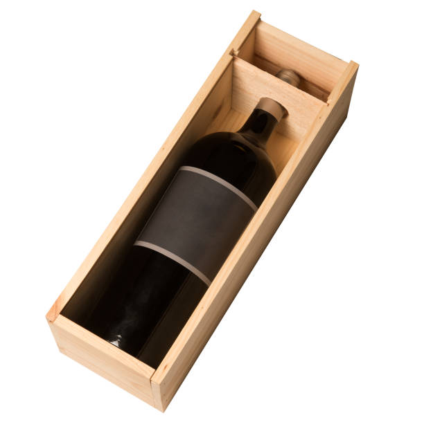 istock Wine bottle in wooden box isolated on white background 881720196