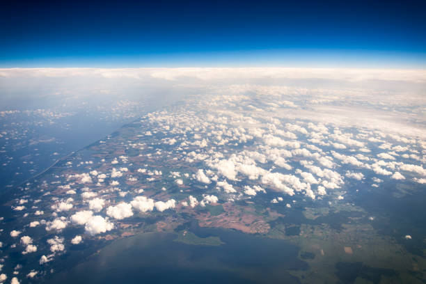istock Clouds and land seen from the aircraft 881720294
