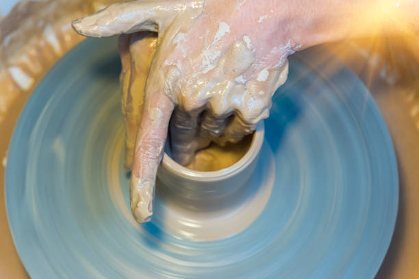 istock womens hands of a potter creating an earthen jar 881722724