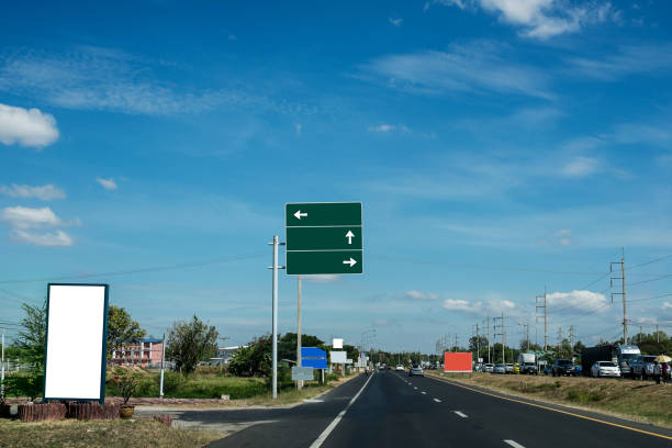 istock Signboard on the road a route in front of 881723436