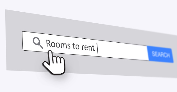 A cursor hovering over a search bar with the text 'Rooms to Rent'
