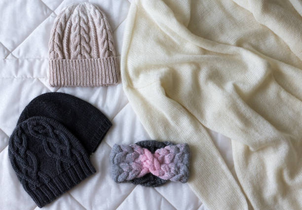 istock Winter accessory collection. Hat, scarf and mittens, on white background. 881729250