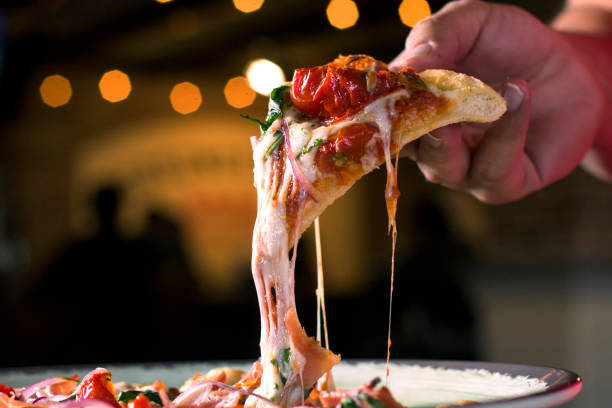 Grabbing a slice of pizza