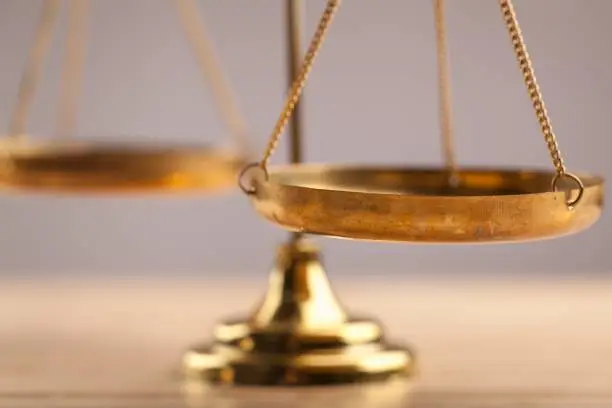 Law scales on table, close-up view