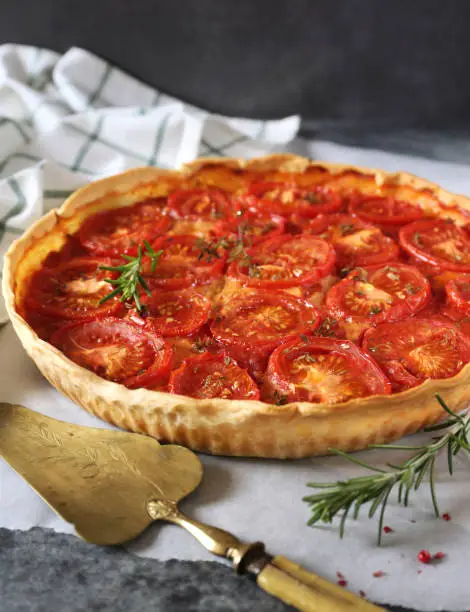 Red tomato vegetable pie with rosemary