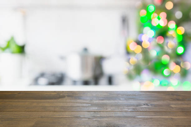 istock Christmas table background with christmas tree in kitchen out of focus. Background for display your products. 881769902