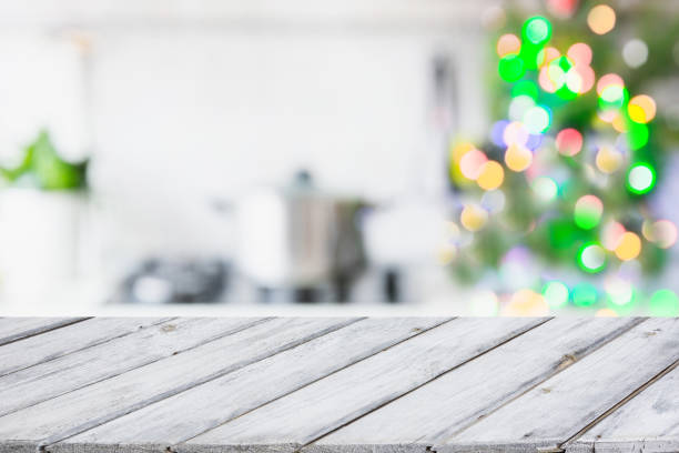 istock Christmas table background with christmas tree in kitchen out of focus. Background for display your products. 881769920