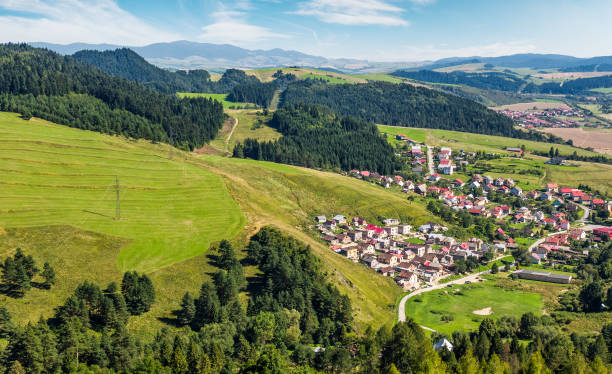 istock Slovakian town on grassy hillside in summer 881770466