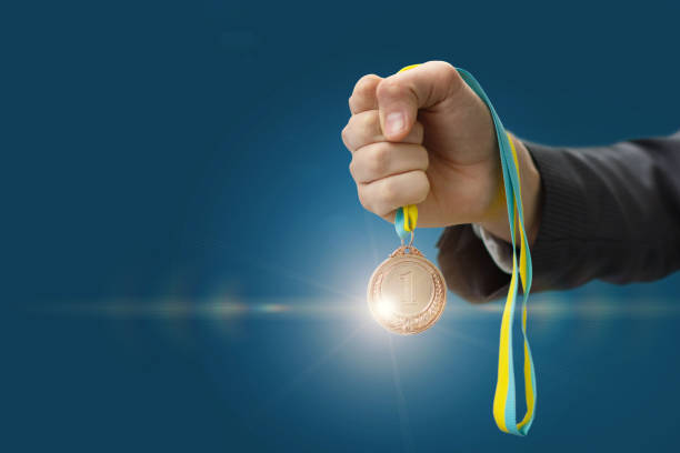 Medal in hand businessman .