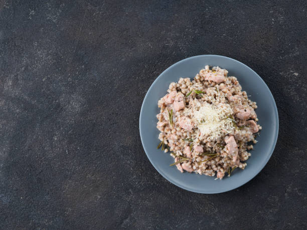 istock Raw buckwheat risotto with chicken meat and rosemary 881776056