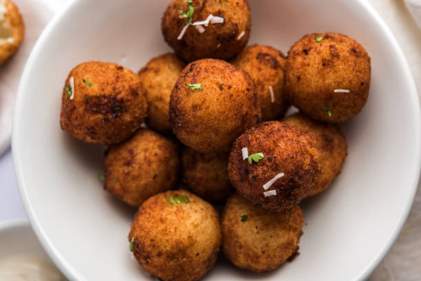 istock Fried potato cheese balls or croquettes with tomato ketchup. Selective focus 881776206