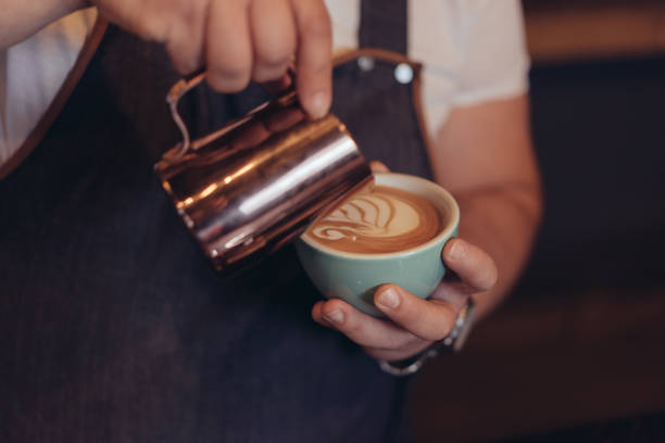 istock Barista Pouring Latte Art 881778562