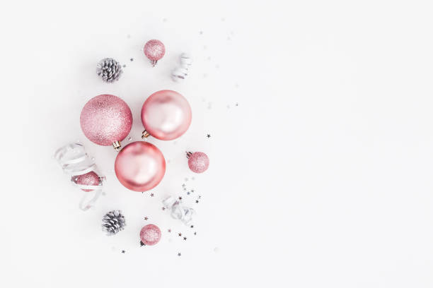 istock Christmas balls, pink and silver decorations. Flat lay, top view 881782164