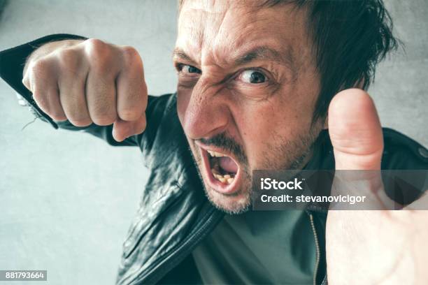Aggressive Man Punching With Fist Stock Photo - Download Image Now - Fighting, Criminal, Violence