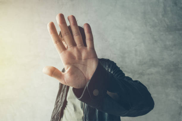istock Celebrity male hiding face with hands 881793780