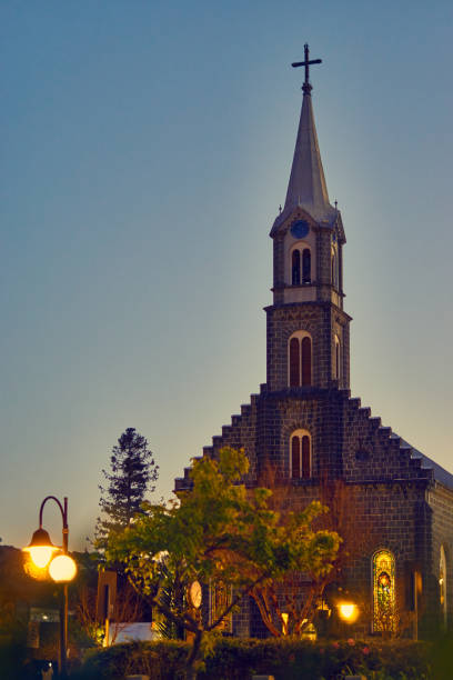 Central church of the lawn at dusk. stock photo