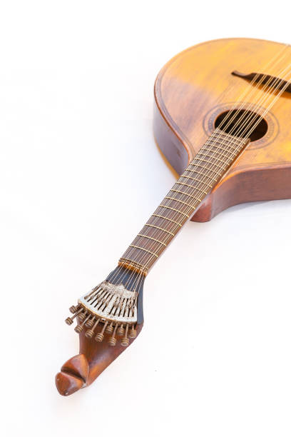 istock Portuguese guitar,  with tradicional fan (or peachow, watchkey) tuners - white background 881817336