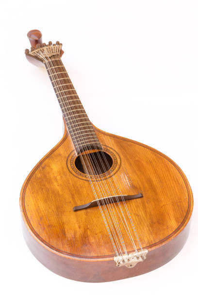 istock Portuguese guitar,  with tradicional fan (or peachow, watchkey) tuners - white background 881817342