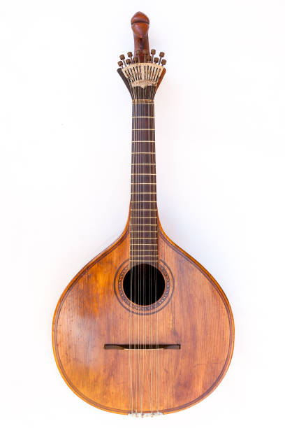 istock Portuguese guitar,  with tradicional fan (or peachow, watchkey) tuners - white background 881817350