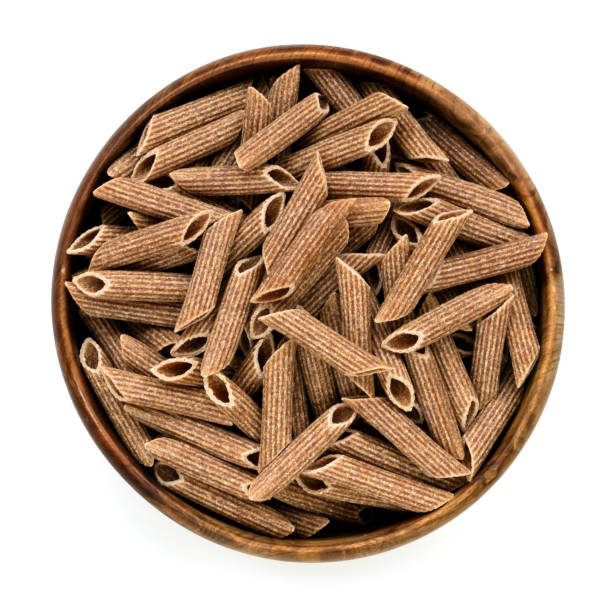 Wholemeal Penne Pasta in Bowl Top View Isolated