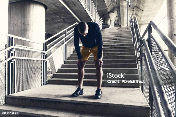 Tired Male Runner Resting After Training Stock Photo - Download Image Now - Tired, Exercising, Exhaustion