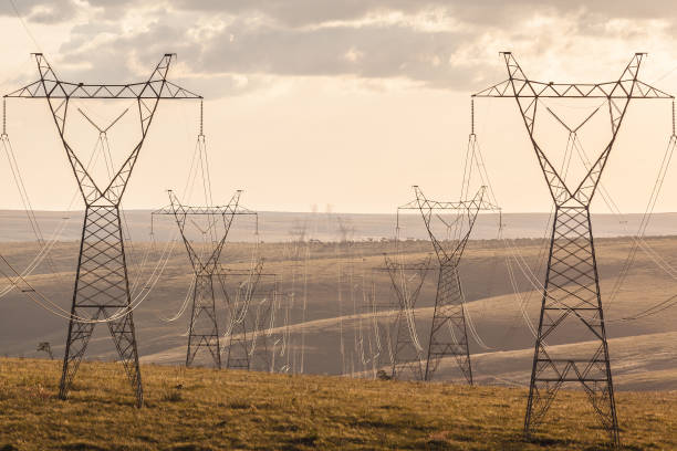 istock High voltage post. High-voltage transmission lines at sunset. 881828916