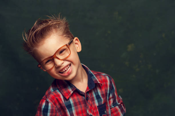 istock Positive cute little boy posing 881834680