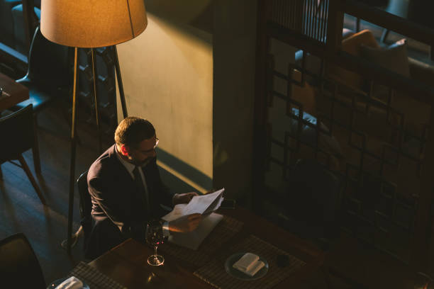 Mature Businessman Working in High-End Restaurant