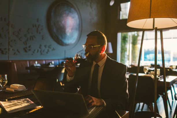 istock Mature Businessman Working in High-End Restaurant 881838156