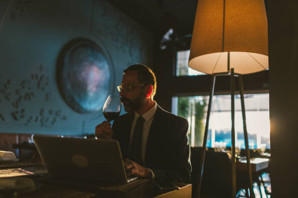istock Mature Businessman Working in High-End Restaurant 881838560