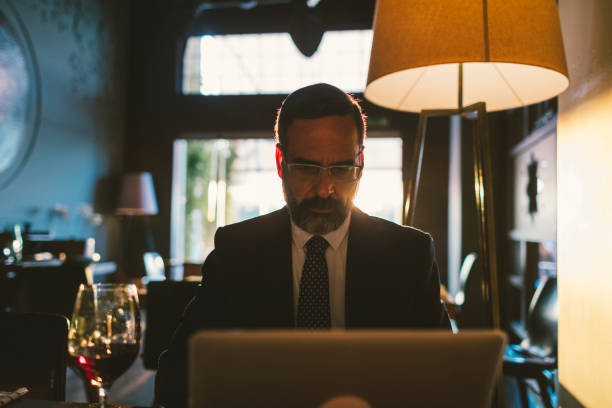 istock Mature Businessman Working in High-End Restaurant 881838566