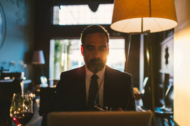istock Mature Businessman Working in High-End Restaurant 881838574